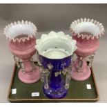 A pair of pink glass lustres and a mid blue glass lustre