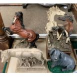 A resin group of two stallions, a further single stallion, another of Romulus and Remus and a pig