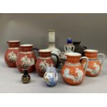 A set of three Victorian graduated jugs printed and painted with scenes of Greek figures and