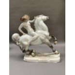 A Herend porcelain figure of a nude female on horseback on a naturalistic rectangular plinth base,