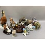 A collection of animal figures including Australian pottery dish with seven kookaburras perched on