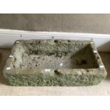 A stone trough, 84cm wide x 22cm high x 43cm deep, with drainage holes