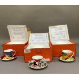 Three reproduction Clarice Cliff cups and saucers from the Cafe Noir range in designs Monsoon, Red