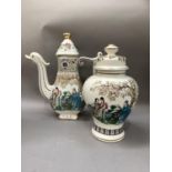A large Chinese coffee pot printed with figures in a garden landscape, the spout modelled as a