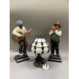 A pair of reproduction figures of Musicians and a reproduction Tiffany lamp