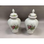 A pair of Spode hexagonal vases and covers with finials, polychrome printed with peonies and other