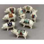 A collection of eight crested china pigs, including Carlton ware, Willow art, Arcadian and other