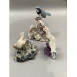 Three Brazilian specimen mineral sculptures of a pair of parakeets perched on a rock, 11.5cm high, a