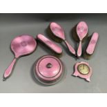 A George V silver and pink enamelled dressing table set with hallmarks for London 1926, 27 and 1930,