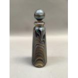 A studio glass iridescent scent bottle of tapered outline with rounded stopper, indistinctly