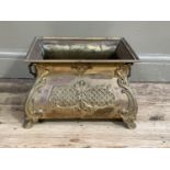 A brass rectangular planter of rococo design with carrying handles