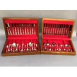 A suite of community plate cutlery contained in two teak canteens and comprising twelve dinner