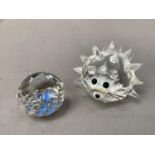 A Swarovski hedgehog, diameter 6.5cm, no packaging, and a Swarovski crystal society sphere with