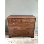 Early 20th century mahogany chest of two short and three long graduated drawers with brass ring