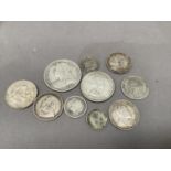 A small quantity of foreign silver coins plus Victoria halfcrown