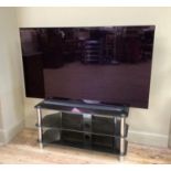 An LG OLED flatscreen television, model number 65C14LB, screen size 167cm (65 inch) together with