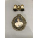 A pair of mother-of-pearl and gilt opera glasses marked Iris, Paris together with a miniature head