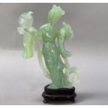 A Chinese jade style figure of a deity representing longevity, 20.5cm high with stand and original