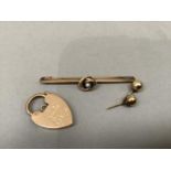 An Edward VII padlock fastener in 9ct rose gold monogramed EHJ? together with a pearl and knot bar