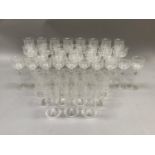 A suite of etched glass ware, early 20th century, comprising eight hock glasses, twelve long stemmed