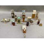 A collection of vintage perfume bottles including perfume houses Christian Dior, Balmain, Goya,