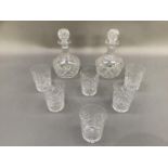 A set of six cut glass water glasses and a pair of closely matched decanters