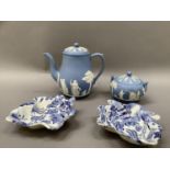 A pair of 19th century leaf moulded pickle dishes printed in blue and white in the willow pattern