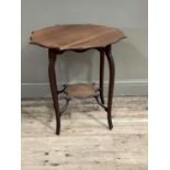 An Edwardian mahogany window table with under tier