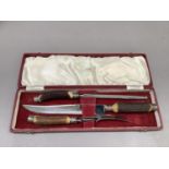 A three piece horn handled carving set of knife, fork and steel by the Northern Goldsmiths