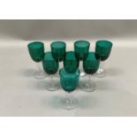 Eight emerald green wine glasses