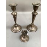 A pair of George V silver candlesticks on circular spreading bases, 23cm high, Birmingham 1903