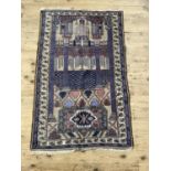 A vintage prayer rug, the camel field with prayer niche and pillars in shades of blue and coral