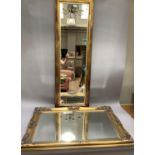 A rectangular gilt swept wall mirror with bevelled glass, approx 91cm x 65cm, together with