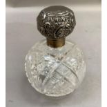 A late Victorian silver lidded cut glass scent bottle, spherical outline, London 1899, 12cm high
