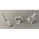 Three Swarovski crystals in the form of a squirrel, a mouse and an owl