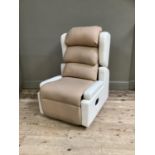A Primacare electrically operated reclining chair in ivory and beige leatherette