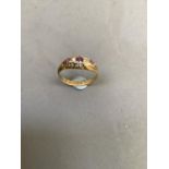 A George V Rhodalite garnet and diamond five stone ring in 18ct gold, the graduated faceted stones