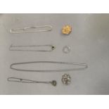 A small collection of silver and silver gilt jewellery including two brooches several pendants and