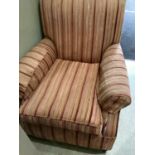 An Edwardian arm chair, reupholstered in velvet and flat weave stripe in tones of coral, on bun feet