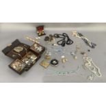 A collection of mid to late 20th century costume jewellery including a single carved jet ear