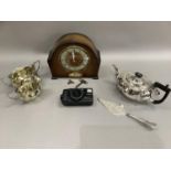 An oak mantel clock, three piece tea service and a silver plated cake slice and a Cannon Sureshot
