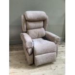 An electrically operated reclining chair upholstered in oatmeal velour.