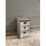 A bleached wood three drawer chest of narrow proportions, 35cm wide x 62cm high x 57cm deep