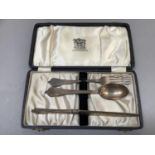 A child's silver knife, spoon and fork set by Elkington & Co, Birmingham 1947/48 in fitted case.