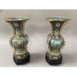A pair of Chinese and gilt metal cloisonné vases, circa 1960-70 of baluster form with everted rim,