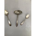 A late 19th century Dutch .835 silver straining spoon together with an early 19th century Irish