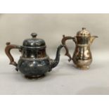 A silver plated teapot and hot water jug with Celtic banding and leaf capped spout with