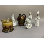 Lladro figures, Inuit girl with polar bear cub , girl with candle and girl with basket, a Doulton