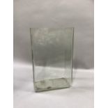 A large rectangular glass vase, 32cm high by 28cm wide by 17cm deep