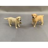 Two boxed figures of dogs
